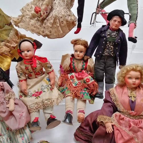 217 - A vintage collection of 18 costume dolls the talest 36cm high including Nistis Spanish doll, Peggy N... 