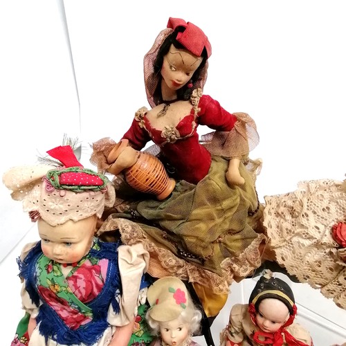 217 - A vintage collection of 18 costume dolls the talest 36cm high including Nistis Spanish doll, Peggy N... 