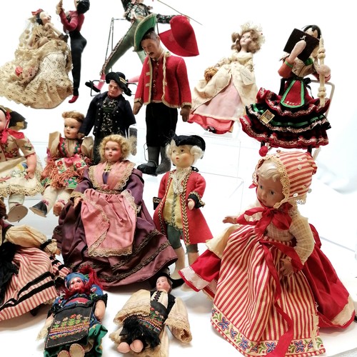 217 - A vintage collection of 18 costume dolls the talest 36cm high including Nistis Spanish doll, Peggy N... 