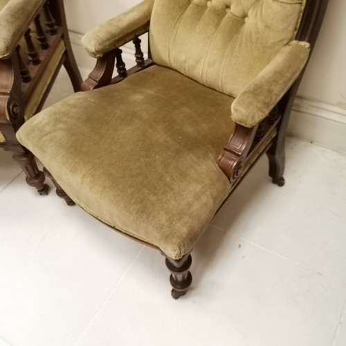 264 - Pair of Antique mahogany framed button and scroll back Library chairs, upholstered in a light green ... 