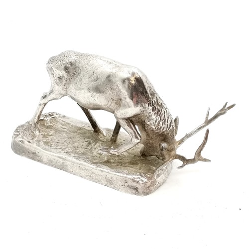 311 - Antique silver plated figure of a charging stag, in good condition, 15 cm wide x 9 cm high.