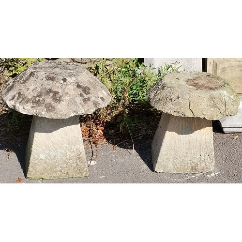 23 - Pair of concrete staddle stones, 52 cm diameter, 57 cm high, weathered condition.