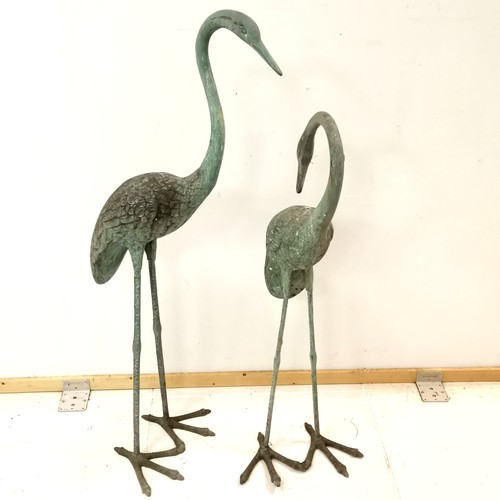 27 - Pair of bronze garden storks, with Verdigris finish, largest standing 113 cm high.