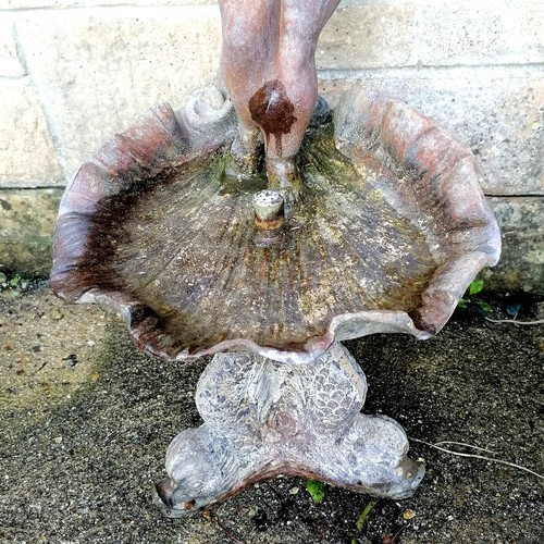 29 - Antique lead water feature of a putti figure standing on a shell above a dolphin base  total height ... 