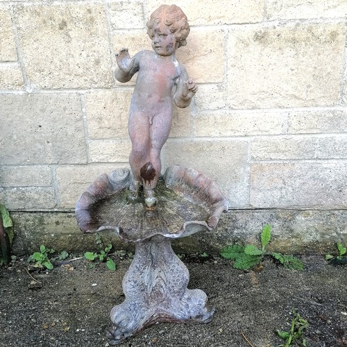 29 - Antique lead water feature of a putti figure standing on a shell above a dolphin base  total height ... 