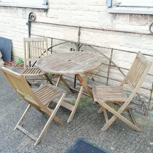 43 - Teak circular folding table with 3 folding chairs, table 90cm diameter - weathered but no obvious da... 