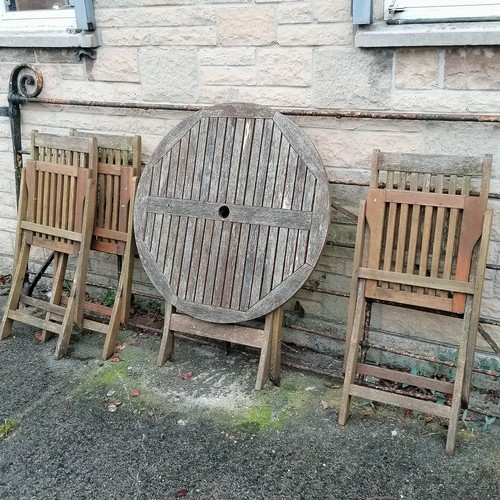 43 - Teak circular folding table with 3 folding chairs, table 90cm diameter - weathered but no obvious da... 