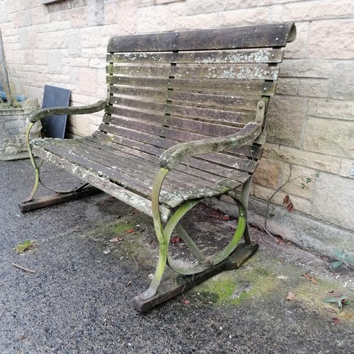 44 - Antique iron strap work high back bench with wooden slats and wooden sleigh feet 129cm long x 99cm h... 