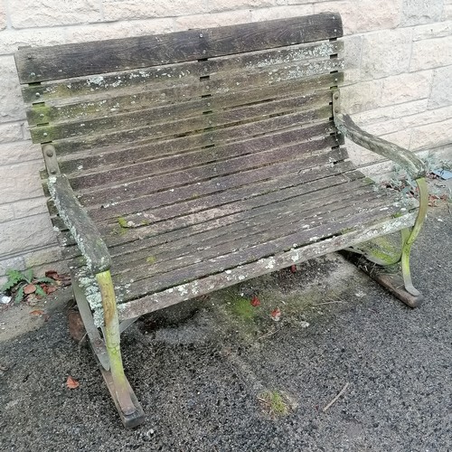 44 - Antique iron strap work high back bench with wooden slats and wooden sleigh feet 129cm long x 99cm h... 