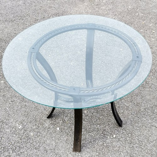 51 - Black metal framed circular glass topped table - 66cm diameter x 47cm high