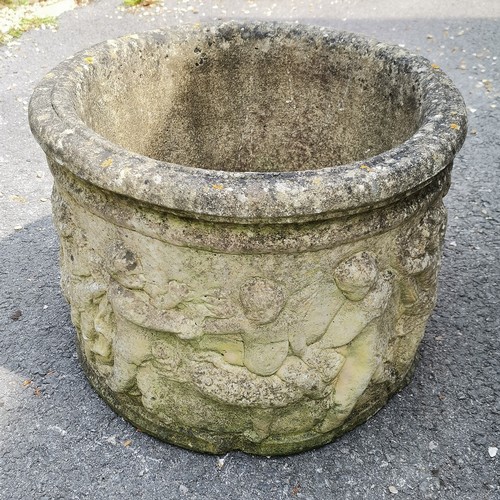 93 - Pair of concrete circular planters with putti detail 36cm high x 46cm diameter