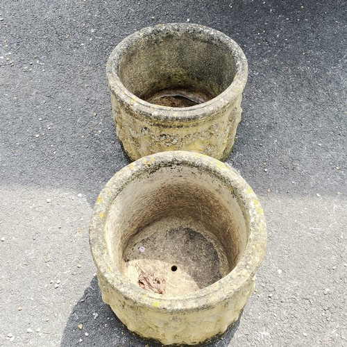 93 - Pair of concrete circular planters with putti detail 36cm high x 46cm diameter