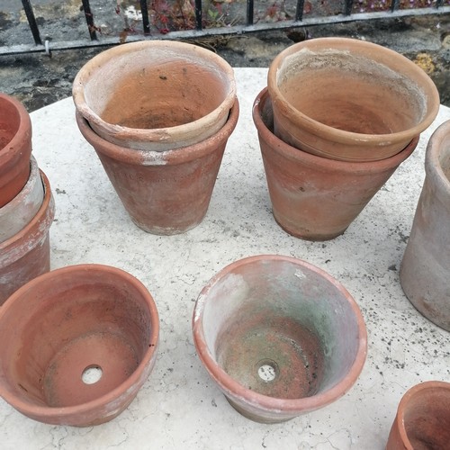 111 - Quantity of 23 terracotta pots and 1 dish tallest 20cm diameter x 18cm high