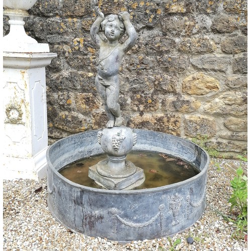 86 - Antique circular lead pond with swag decoration T/W a lead putti figure on a ball pedestal with 4 wa... 