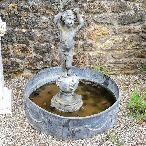 86 - Antique circular lead pond with swag decoration T/W a lead putti figure on a ball pedestal with 4 wa... 