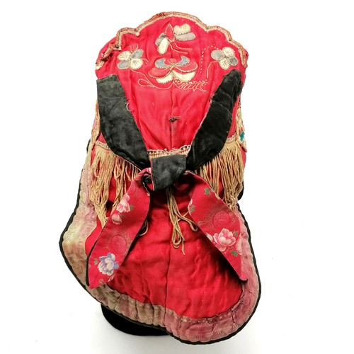 130 - Antique Oriental red silk embroidered hat with fringe and brocade detail - has obvious signs of colo... 