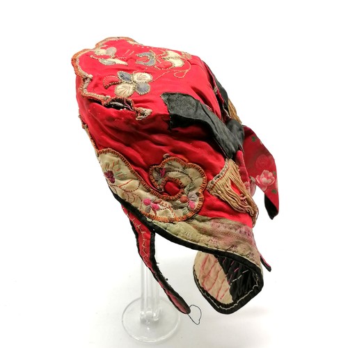 130 - Antique Oriental red silk embroidered hat with fringe and brocade detail - has obvious signs of colo... 