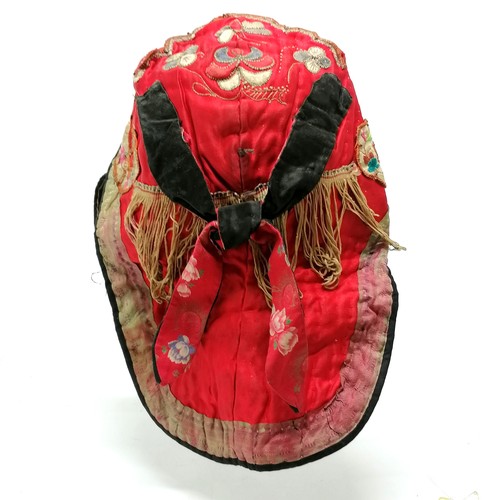 130 - Antique Oriental red silk embroidered hat with fringe and brocade detail - has obvious signs of colo... 