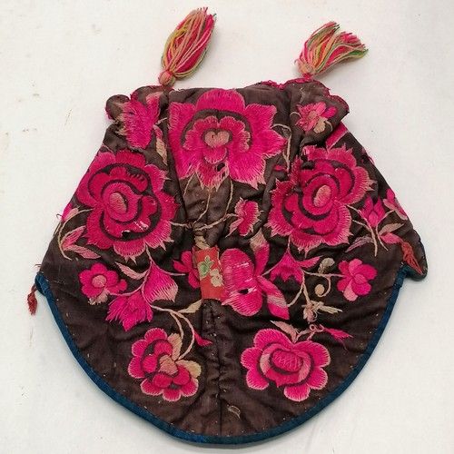 132 - Antique Chinese embroidered cloth hat pink decorated with flowers and has tassels - has signs of wea... 