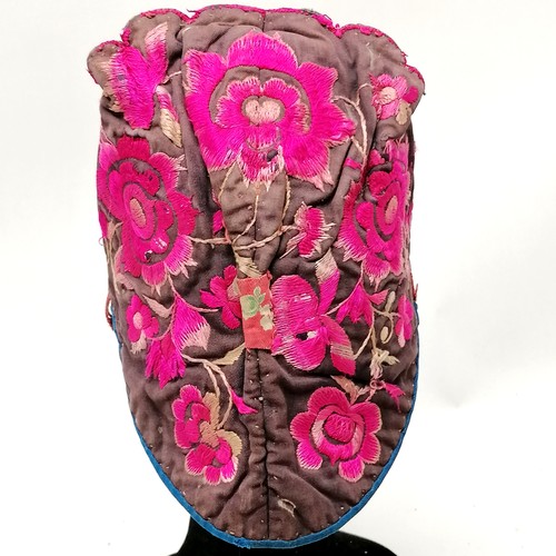 132 - Antique Chinese embroidered cloth hat pink decorated with flowers and has tassels - has signs of wea... 