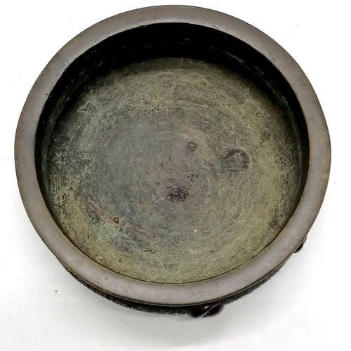 141 - Oriental antique bronze censer profusely decorated with character marks to base & terminating on 4 s... 