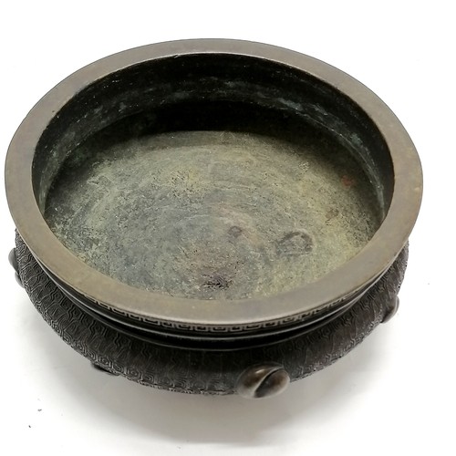 141 - Oriental antique bronze censer profusely decorated with character marks to base & terminating on 4 s... 