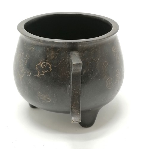 142 - Chinese antique bronze censer with silver inlaid dragon detail and 2 tag handles terminating on 3 fe... 