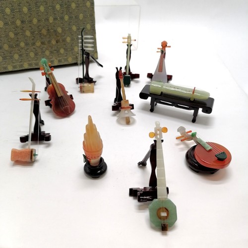 149 - Boxed set of 10 x hardstone musical instruments with stands - box 24cm x 28cm with no obvious damage