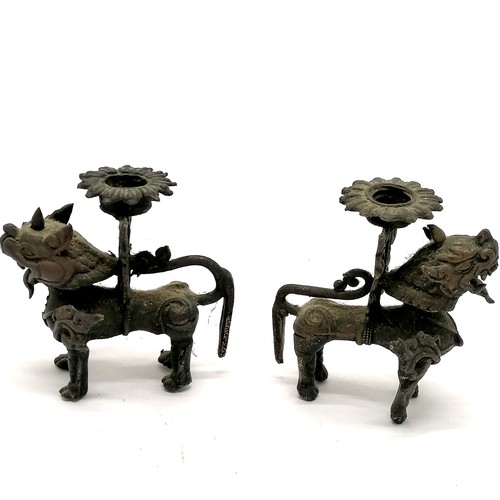 169 - Pair of Burmese lion dog bronze candlesticks - 9cm high with no obvious damage