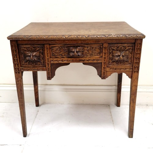 179 - Antique hand carved oak 3 drawer side table with green man cut handles & chip carved border to the t... 