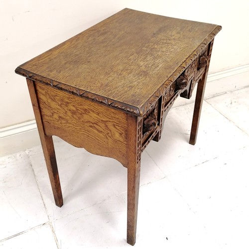 179 - Antique hand carved oak 3 drawer side table with green man cut handles & chip carved border to the t... 