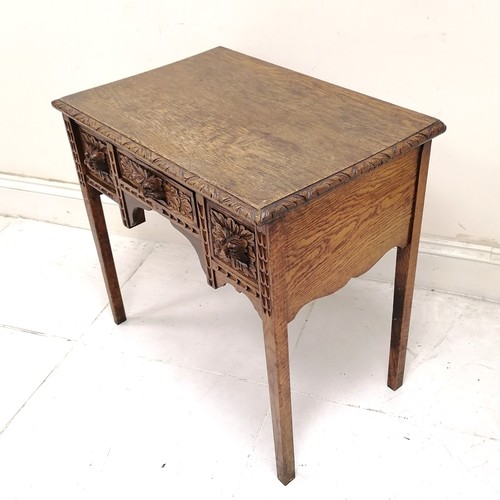 179 - Antique hand carved oak 3 drawer side table with green man cut handles & chip carved border to the t... 