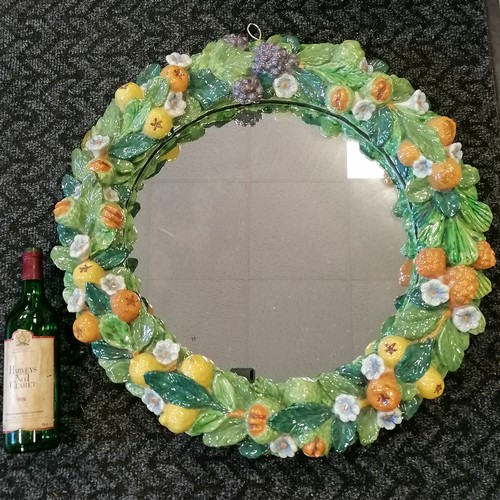 227 - Impressive majolica circular mirror with fuit and leaf detail - 65cm diameter ~ has signs of wear an... 