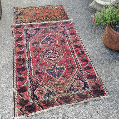 236 - 2 x hand woven carpets / rugs ~ smallest 130cm x 104cm - both in worn used condition with some losse... 