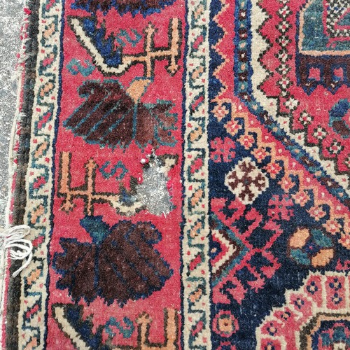 252 - 2 x antique Eastern rugs - largest 107cm x 150cm ~ both a/f