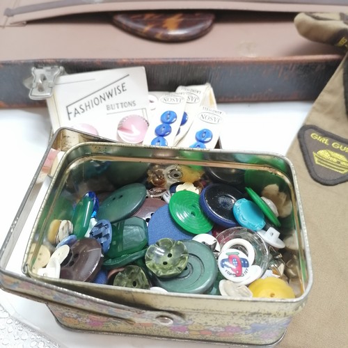 304 - Girl guide badges, vintage buttons, tins etc t/w a fitted suitcase (a/f)