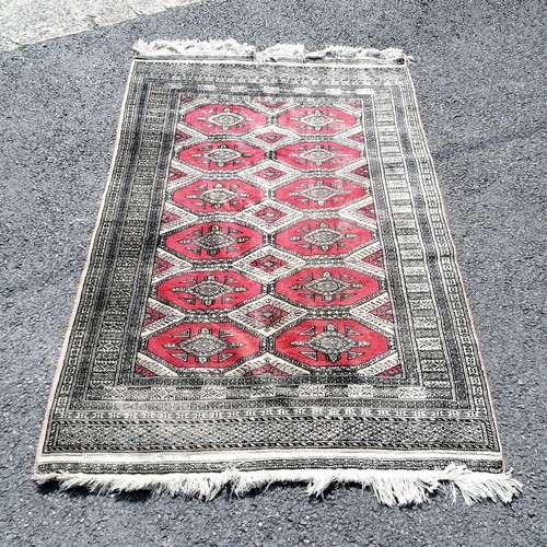 330 - Terracotta grounded rug 128cm x 190cm