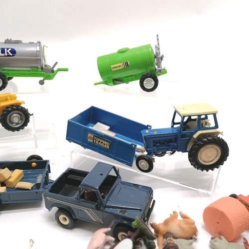 334 - Vintage plastic farm toys lot in die cast tractor + trailer, Britains etc