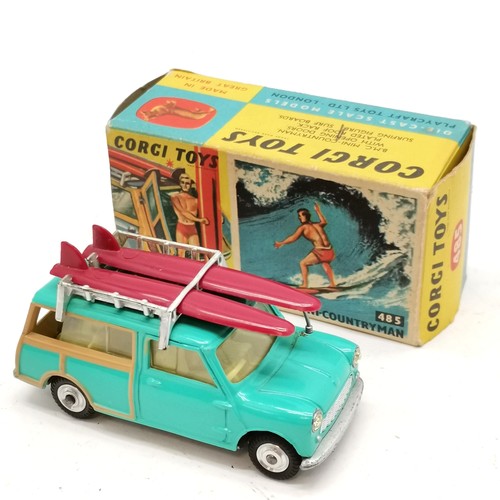 352 - Corgi boxed #485 B.M.C. Mini-countryman complete with surfer figure