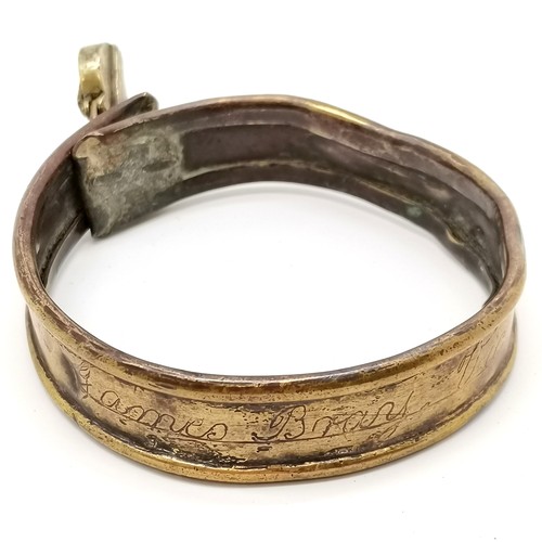 376 - Antique brass dogs collar with original padlocked clasp - 8cm diameter and has dents + inscription '... 