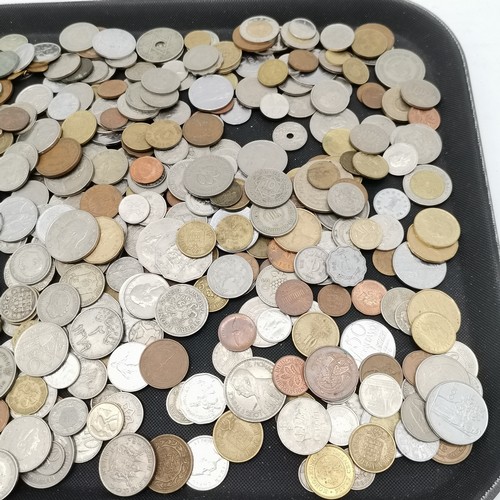 385 - Qty of mostly foreign coins in a shortbread tin