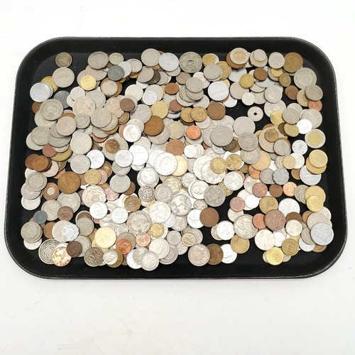 385 - Qty of mostly foreign coins in a shortbread tin