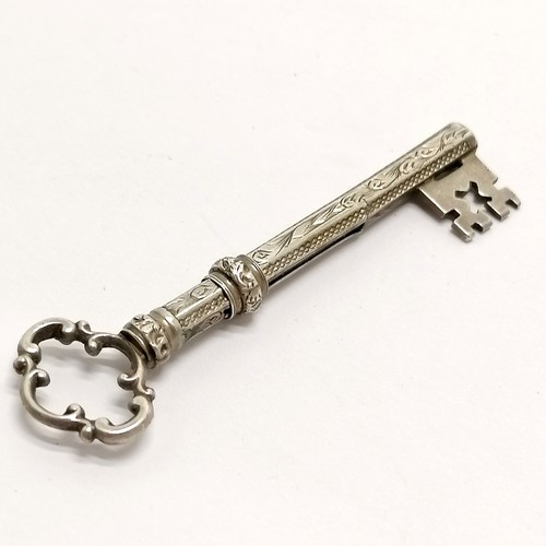 493 - Novelty antique unmarked silver propelling pencil in the form of a key - 6.6cm and is slight a/f to ... 