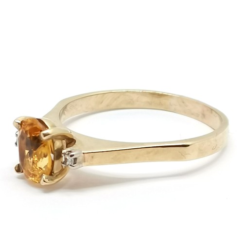 396 - 9ct marked gold citrine ring with diamond set shoulders - size U½ & 3.6g total weight ~ the citrine ... 