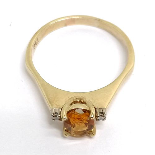 396 - 9ct marked gold citrine ring with diamond set shoulders - size U½ & 3.6g total weight ~ the citrine ... 