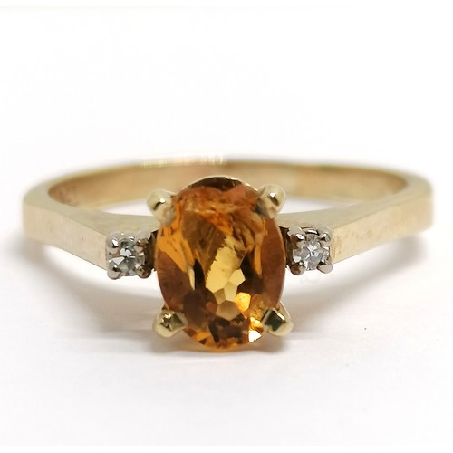 396 - 9ct marked gold citrine ring with diamond set shoulders - size U½ & 3.6g total weight ~ the citrine ... 