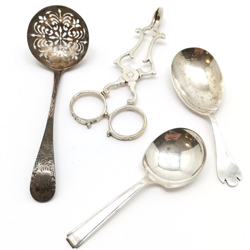 717 - Silver - scissor action sugar tongs with shell bowls, 2 caddy spoons & Victorian sifting spoon (12.5... 