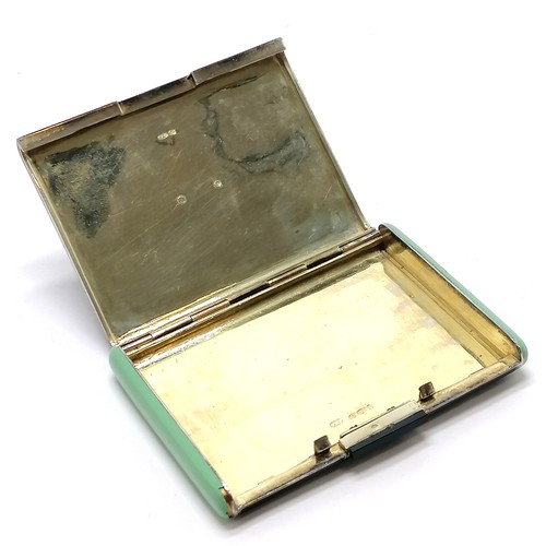719 - Art Deco silver gilt hallmarked cigarettes box with sprung lid & hand carved jade panel to top by P ... 