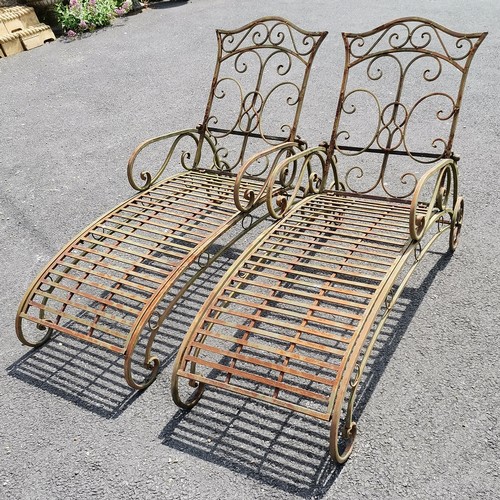 37 - Pair of tubular steel adjustable sun loungers - 145cm long x 88cm high x 56cm wide with some surface... 