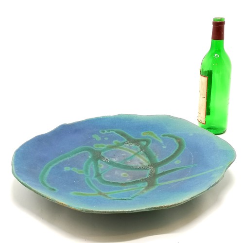 69 - Art pottery large green / blue dish with makers mark GAB on 4 stile feet and with high fired glaze &... 